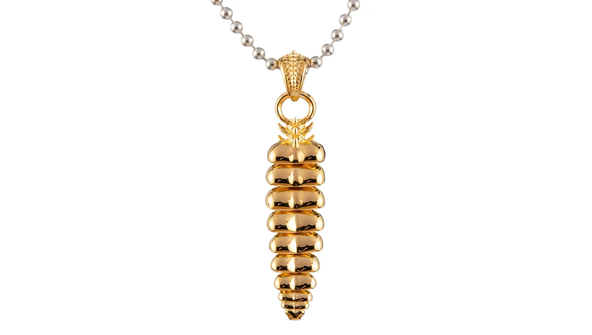 Gold plated necklace featuring a spiral pendant, displayed on a white background, showcasing high-end jewelry retouching.