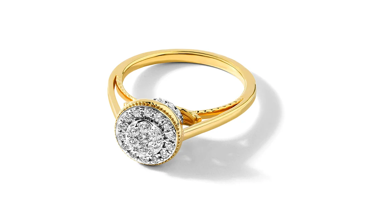 A stunning yellow gold diamond ring with a halo design, reflecting high polish and exquisite jewelry retouching