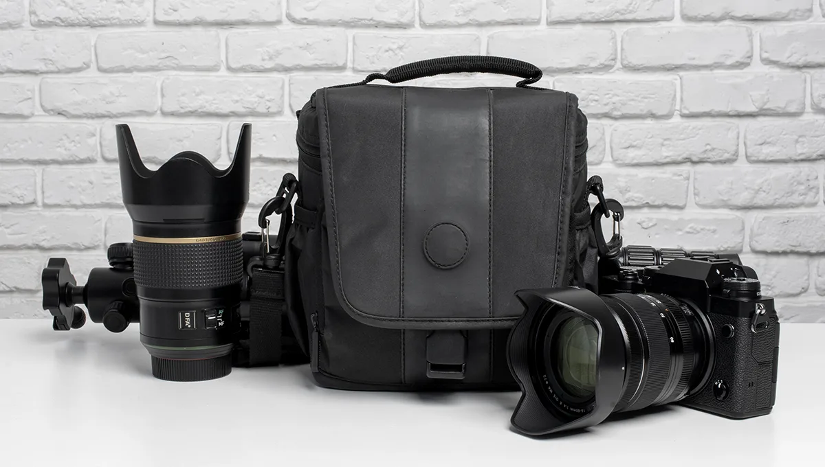 A camera bag containing a camera and lens, showcasing essential equipment for 360 product photography.